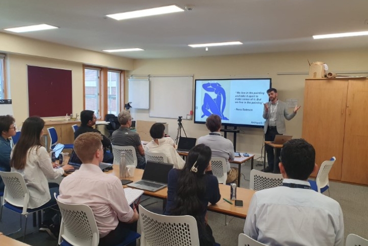 Professor Steve Evans presenting at Homerton College PCSB workshop July 24 Students sat in a classroom setting with the lecturer Steve Evans presenting next to a screen