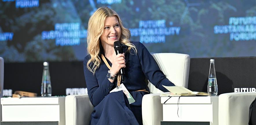 Alice Spencer speaking onstage at an event