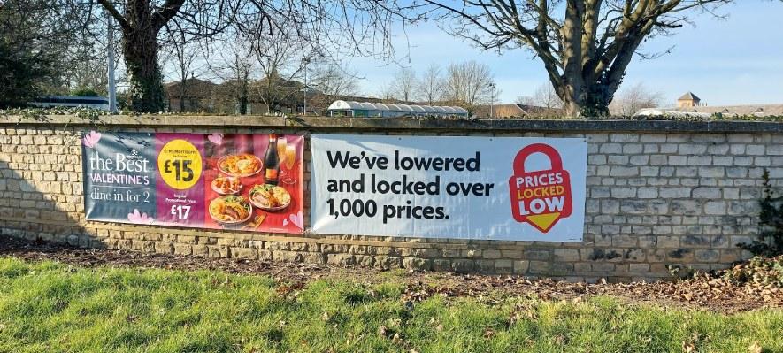 Banners outside supermarket